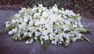 Serene White Casket Spray